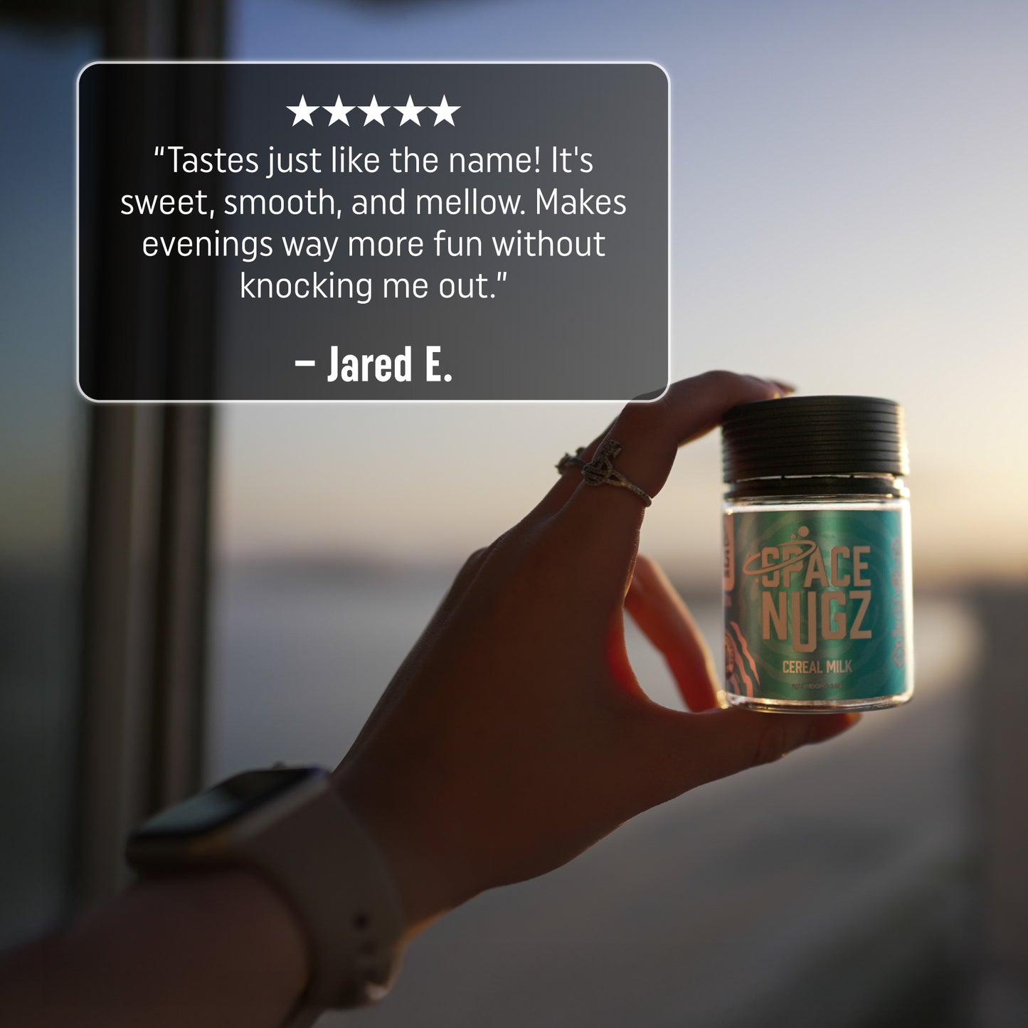 Cereal Milk THCA Flower - Hybrid Flower Strain - Woman Holding Jar Infront of a Sunset - 5 Star Testimonial - Galaxy Treats in the U.S.