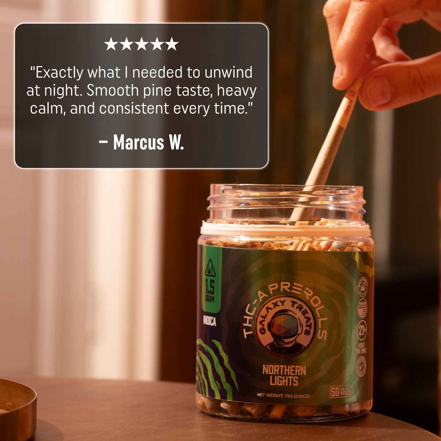 Northern Lights 50 Count THCA Prerolls - 1.5 Gram Indica Flower - Person Grabbing Preroll out of the 50 CT Jar - Hemp Derived Smokable 5 Star Review - Galaxy Treats in the U.S.