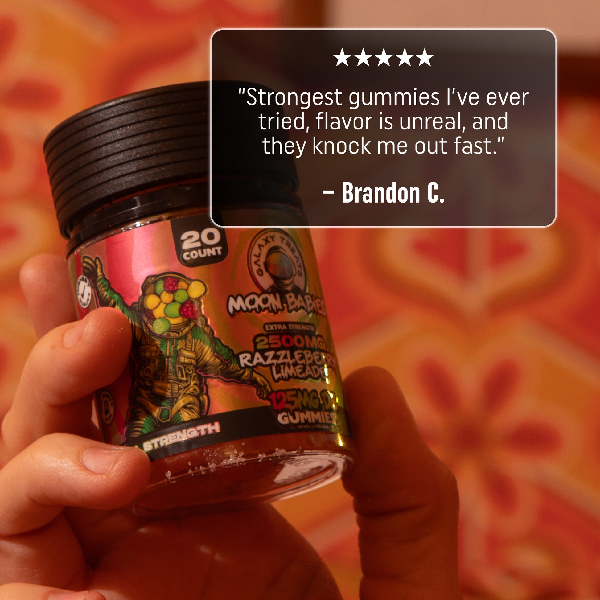 125MG Raspberry Lemonade Delta 8 Edibles - 5 Star Review - Holding Gummy Jar - Galaxy Treats in the U.S.
