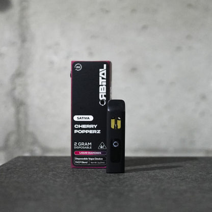 Cherry Popperz Vape - Orbital 2G Sativa Disposable - THCP Liquid Diamonds - Front Shot of Packaging and Vape Device - Galaxy Treats in the U.S.