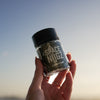 Platinum Kush THCA Flower - Indica Flower Strain - Woman Holding Jar In the Sky - Galaxy Treats in the U.S.