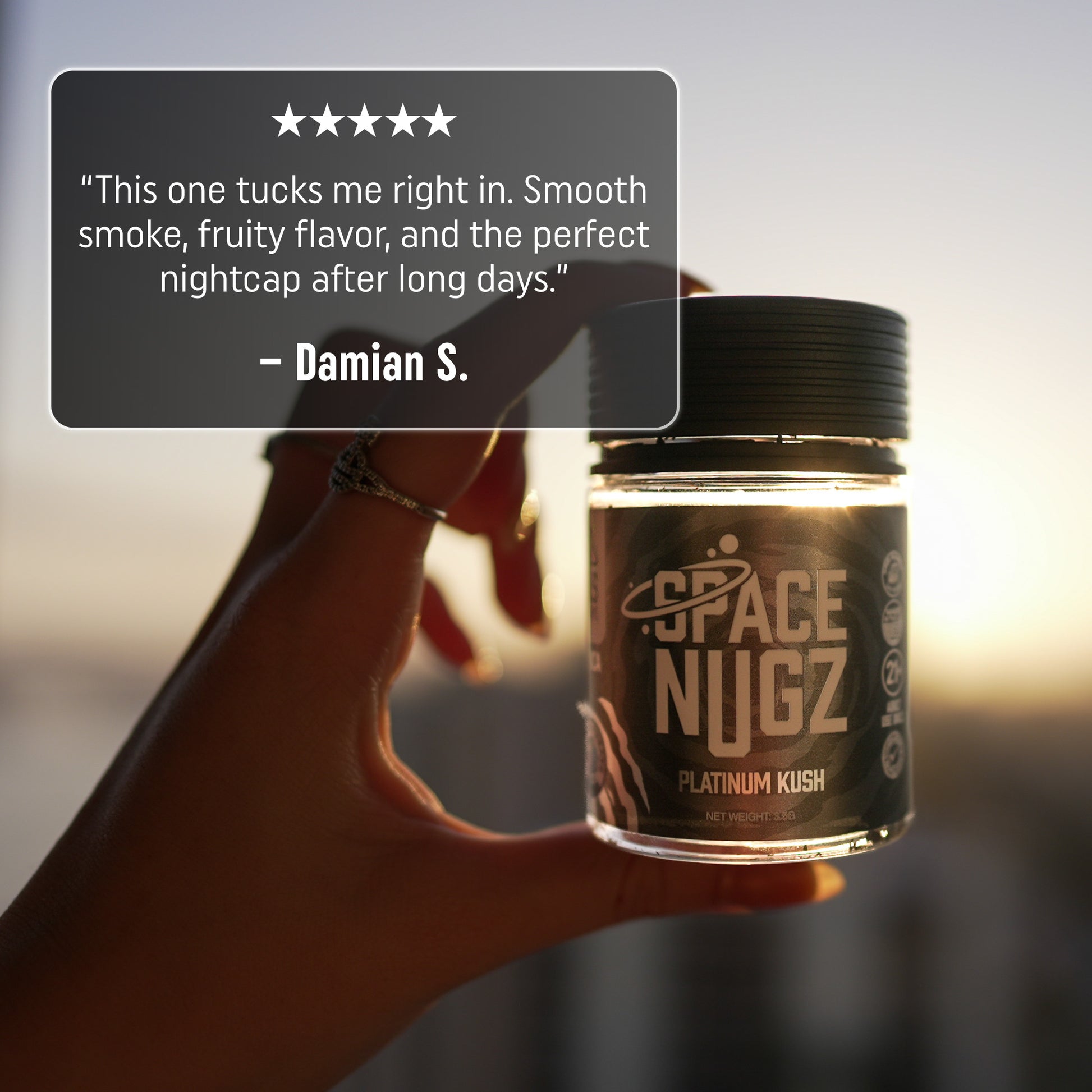 Platinum Kush THCA Flower - Indica Flower Strain - Woman Holding Jar Infront of a Sunset - 5 Star Testimonial - Galaxy Treats in the U.S.