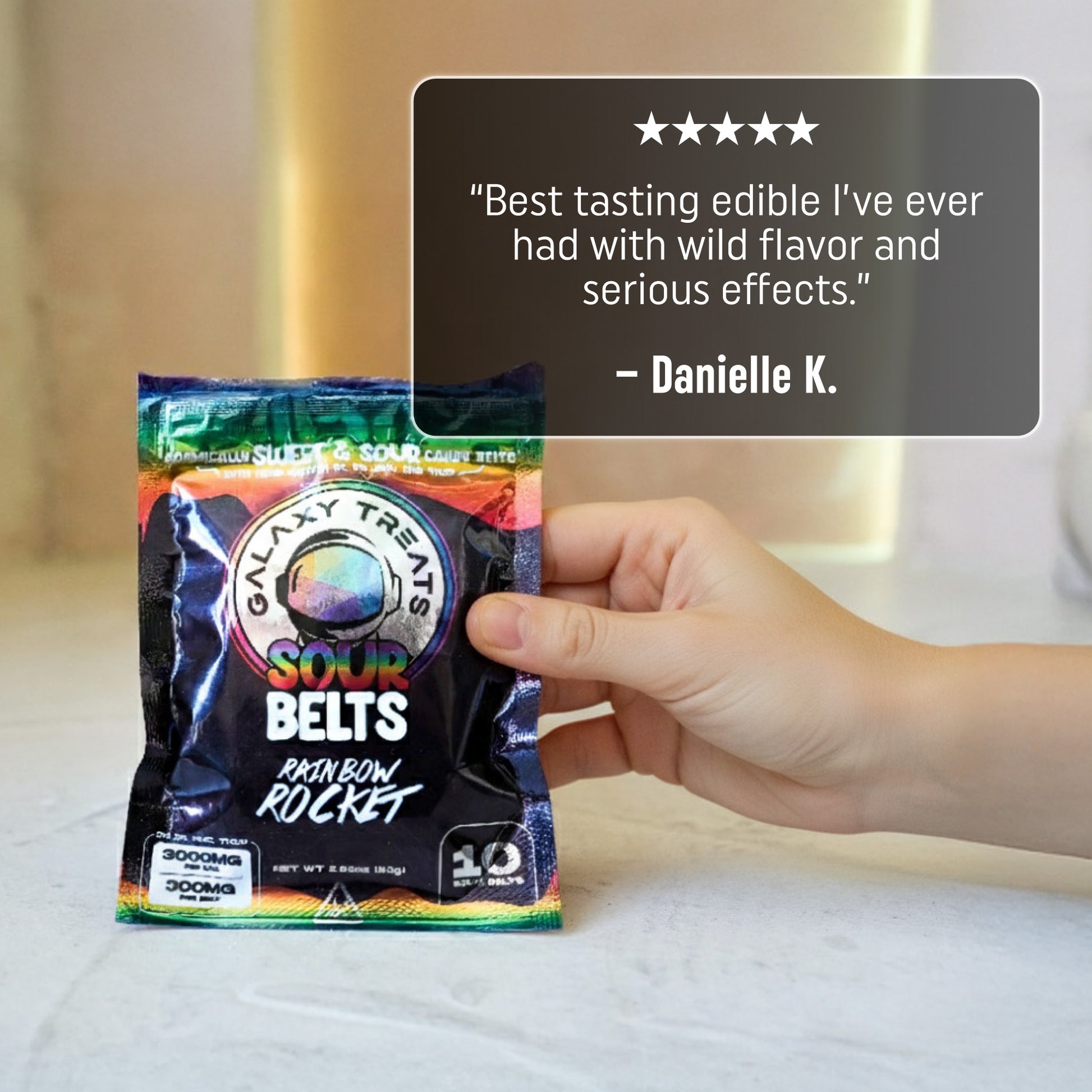 Rainbow Rocket Sour Belts - High Potency 300MG THC Edibles - Hand Holding Packaging - 5 Star Testimonial - Galaxy Treats in the U.S.
